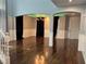 Open living space with hardwood floors, modern lighting, and view of the staircase at 4912 Capo Gallo St, Las Vegas, NV 89130