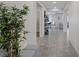 Elegant hallway with tile flooring and modern decor, offering seamless transitions at 5234 Savannah Rose St, Las Vegas, NV 89149