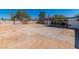Backyard featuring gravel, a storage shed, a patio area, and a partially visible residence at 5582 Tunis Ave, Las Vegas, NV 89122