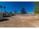 Large backyard with a gravel area, trees, and fencing at 5582 Tunis Ave, Las Vegas, NV 89122