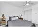 Bedroom featuring a ceiling fan, gray comforter, and a closet with sliding doors at 5582 Tunis Ave, Las Vegas, NV 89122