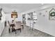 Bright dining room featuring table and chairs, pendant lighting, and an open floor plan with a modern kitchen at 5582 Tunis Ave, Las Vegas, NV 89122