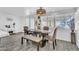 Dining room featuring a table with seating, and a chandelier above, creating an inviting atmosphere at 5582 Tunis Ave, Las Vegas, NV 89122