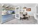 Dining room leading to an outdoor patio, dining table, and white walls at 5582 Tunis Ave, Las Vegas, NV 89122