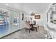 Charming dining room featuring a table with seating and French doors leading to outdoor space at 5582 Tunis Ave, Las Vegas, NV 89122