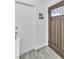 Foyer with wood-look tile flooring and decorative front door at 5582 Tunis Ave, Las Vegas, NV 89122