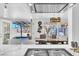Bright kitchen features modern lighting, stainless steel appliances, and a marble countertop at 5582 Tunis Ave, Las Vegas, NV 89122