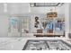 Open-concept, modern kitchen with marble countertops connecting to the dining area at 5582 Tunis Ave, Las Vegas, NV 89122