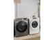 A clean laundry area showcasing a modern silver Samsung washer and a matching white dryer at 5582 Tunis Ave, Las Vegas, NV 89122