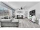 Comfortable living room with a large gray sectional couch and a modern entertainment center at 5582 Tunis Ave, Las Vegas, NV 89122