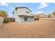 Expansive backyard with room for recreation and entertaining; features a covered patio at 5815 Christchurch Ave, Las Vegas, NV 89110