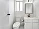 Clean bathroom with white vanity, toilet, mirror, and modern fixtures at 5815 Christchurch Ave, Las Vegas, NV 89110