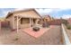 Charming backyard with covered patio, ideal for outdoor relaxation and gatherings at 5991 Saddle Horse Ave, Las Vegas, NV 89122
