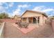 Private backyard featuring patio area and outdoor dining set, perfect for entertaining at 5991 Saddle Horse Ave, Las Vegas, NV 89122