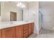 Bathroom with double vanity, neutral colors, and tile floors at 5991 Saddle Horse Ave, Las Vegas, NV 89122