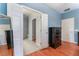 Spacious bedroom featuring views into the ensuite bath, with blue walls and laminate wood-look flooring at 5991 Saddle Horse Ave, Las Vegas, NV 89122