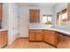 Kitchen featuring stainless steel dishwasher, ample cabinet space, and laminate wood-look flooring at 5991 Saddle Horse Ave, Las Vegas, NV 89122