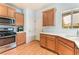 Kitchen featuring stainless steel appliances, ample cabinet space, and laminate wood-look flooring at 5991 Saddle Horse Ave, Las Vegas, NV 89122