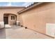 Enclosed patio with textured walls, tile flooring, and a table with seating to relax outdoors at 5991 Saddle Horse Ave, Las Vegas, NV 89122