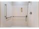 This shower features a handheld sprayer, grab bars and a built in soap dish at 5991 Saddle Horse Ave, Las Vegas, NV 89122