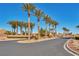 Picturesque community entrance with lush palm trees, enhancing curb appeal and welcoming ambiance at 5991 Saddle Horse Ave, Las Vegas, NV 89122
