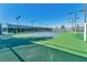 Lit outdoor tennis court for recreational play, promotes an active lifestyle for residents at 5991 Saddle Horse Ave, Las Vegas, NV 89122