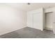 Cozy bedroom featuring neutral carpet and closet with sliding doors at 6155 W Twain Ave, Las Vegas, NV 89103