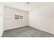 A bright bedroom offers a window view and floating shelves, perfect for storage or decor at 6155 W Twain Ave, Las Vegas, NV 89103
