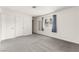 Bright bedroom features neutral carpet, window with blinds, and two closets for ample storage at 6155 W Twain Ave, Las Vegas, NV 89103