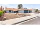 Charming single-story home with a two-car garage and low-maintenance front yard landscaping at 6155 W Twain Ave, Las Vegas, NV 89103