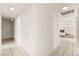 Hallway leading to living room with fireplace at 6155 W Twain Ave, Las Vegas, NV 89103