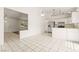 Open-concept kitchen features stainless steel appliances and tile flooring at 6155 W Twain Ave, Las Vegas, NV 89103