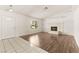 Bright living room features a fireplace, wood flooring, and a front door entrance at 6155 W Twain Ave, Las Vegas, NV 89103