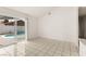 Bright room offers a view of the backyard pool through sliding glass doors at 6155 W Twain Ave, Las Vegas, NV 89103