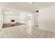 Bright living room features a fireplace, wood flooring, and tile flooring at 6155 W Twain Ave, Las Vegas, NV 89103