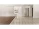 Spacious, light-filled living area with tile floors and sliding mirrored closet doors at 6155 W Twain Ave, Las Vegas, NV 89103