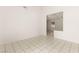 Bright living room with tile flooring and an open doorway to the kitchen at 6155 W Twain Ave, Las Vegas, NV 89103