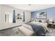 Serene main bedroom with soft blue accents, plush carpeting, and ample natural light at 6155 W Twain Ave, Las Vegas, NV 89103