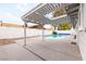 Backyard pool surrounded by a covered patio and hardscape, with ample room for seating at 6155 W Twain Ave, Las Vegas, NV 89103