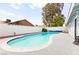 Sparkling backyard pool with a white brick fence, and an expansive concrete deck at 6155 W Twain Ave, Las Vegas, NV 89103