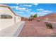 A low-maintenance desert landscaped backyard features a concrete patio and block wall, with privacy in mind at 629 Majestic Sky Dr, North Las Vegas, NV 89031