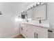 Modern bathroom features a double sink vanity with marble countertop and dark hardware at 629 Majestic Sky Dr, North Las Vegas, NV 89031