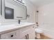 Bathroom featuring white cabinets, modern black hardware, and a shower-tub combination at 629 Majestic Sky Dr, North Las Vegas, NV 89031