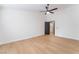 Spacious bedroom with a ceiling fan, closet, and neutral walls with plank floors at 629 Majestic Sky Dr, North Las Vegas, NV 89031