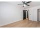 Bedroom featuring ceiling fan, wood-look floors, and closet at 629 Majestic Sky Dr, North Las Vegas, NV 89031