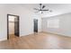 Spacious bedroom with a ceiling fan, closet, and neutral walls with plank floors at 629 Majestic Sky Dr, North Las Vegas, NV 89031