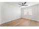 Bedroom with ceiling fan, a window, and light wood-look flooring at 629 Majestic Sky Dr, North Las Vegas, NV 89031