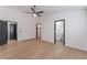 Spacious bedroom with a ceiling fan, access to closet and bathroom, and neutral walls at 629 Majestic Sky Dr, North Las Vegas, NV 89031