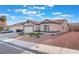 Cozy single-story home with a two-car garage and simple desert-style landscaping at 629 Majestic Sky Dr, North Las Vegas, NV 89031