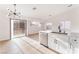 Bright, airy kitchen with stainless steel appliances and an island with sliding glass door access at 629 Majestic Sky Dr, North Las Vegas, NV 89031